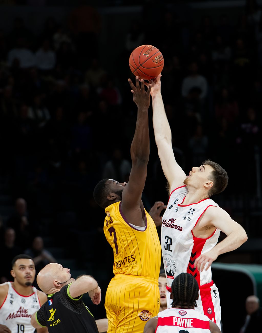 intense basketball tip off during competitive game